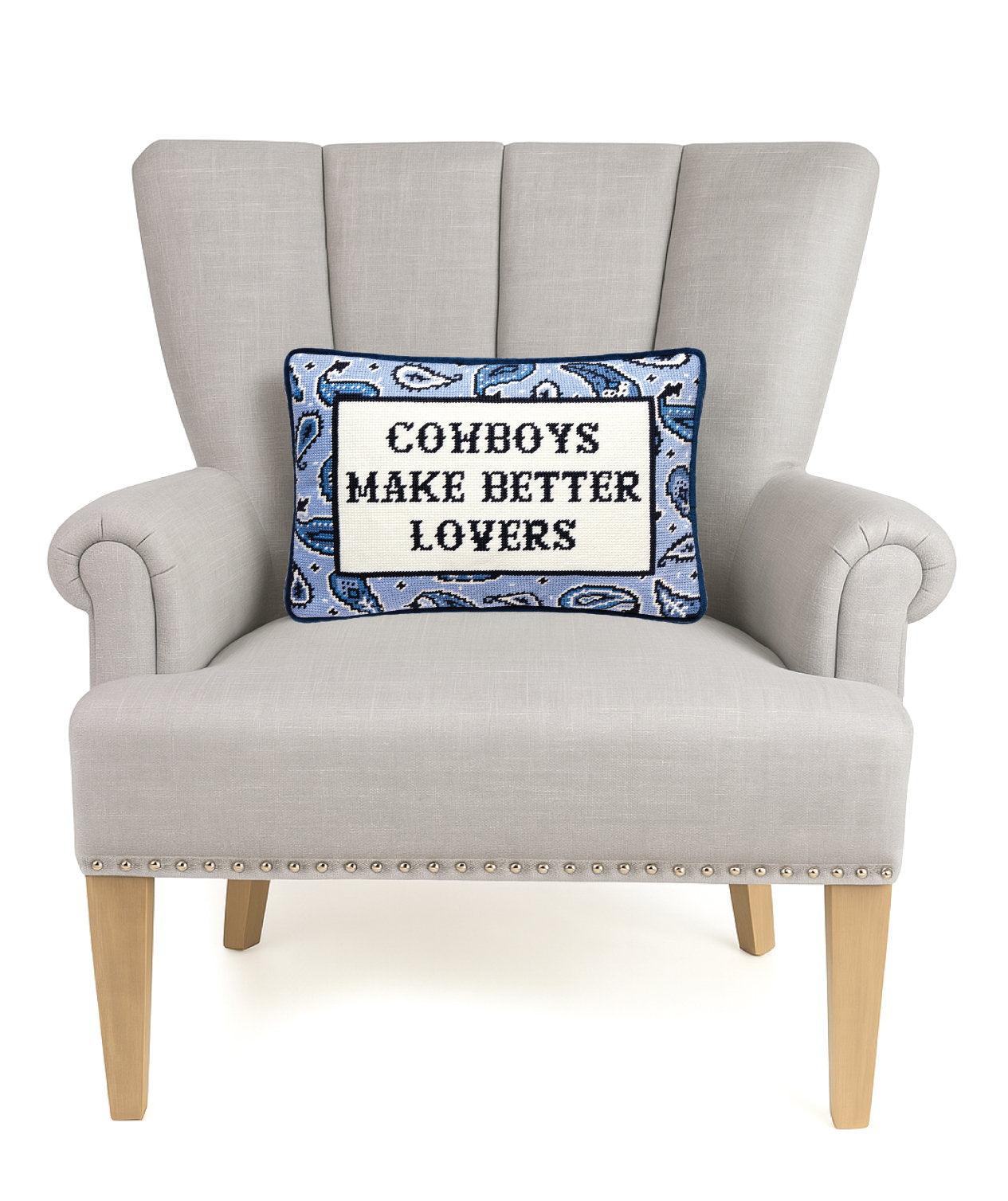 Better Lovers Embroidered Needlepoint Throw Pillow on an armchair, showing the throw pillow at room scale, 10x14 inch