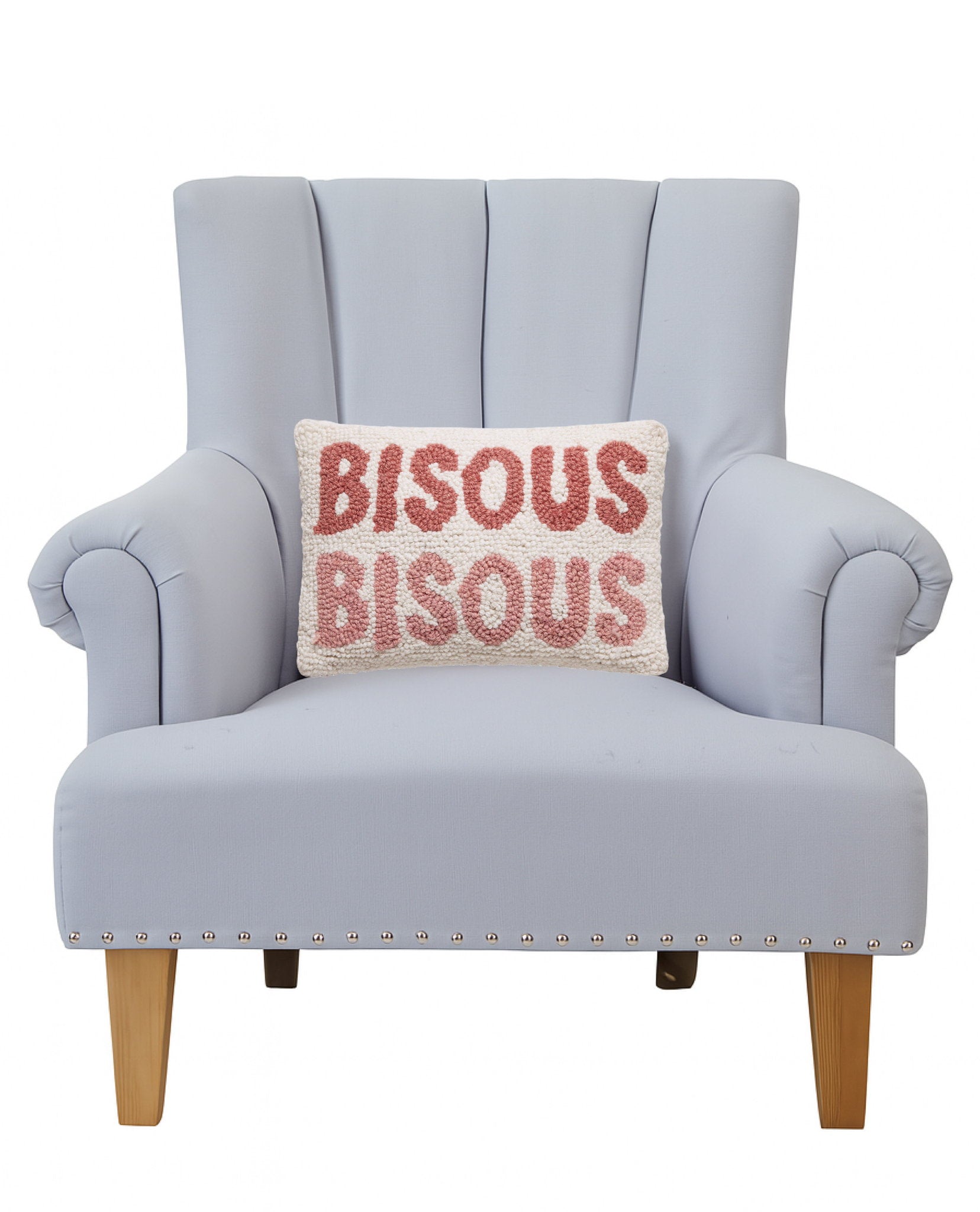 Bisous Bisous Hooked Wool Throw Pillow on an armchair, showing the throw pillow at room scale, 8x12 inch