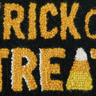 Black and Gold Trick or Treat Hooked Wool Halloween Throw Pillow, close-up detail