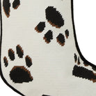 Closeup of Black Paws on White Embroidered Christmas Stocking showing stitch texture and craftsmanship detail