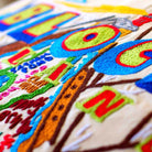 Block Island Coastal Embroidered Travel Throw Pillow - close-up detail of hand-embroidered needlepoint stitching