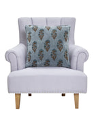 Block Print Velvet Mughal Flower Throw Pillow on an armchair, showing the throw pillow at room scale, 20x20 inch