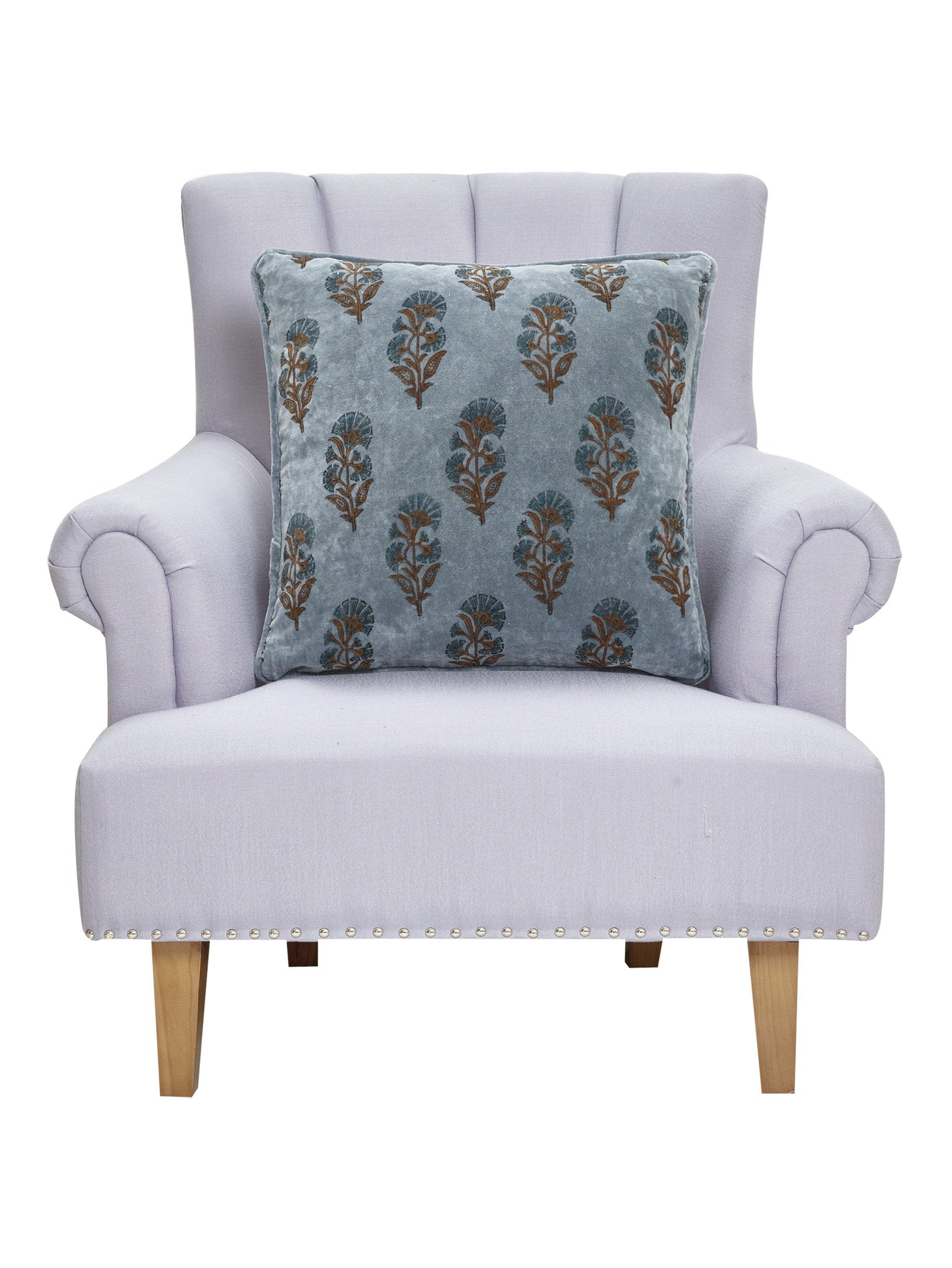 Block Print Velvet Mughal Flower Throw Pillow on an armchair, showing the throw pillow at room scale, 20x20 inch
