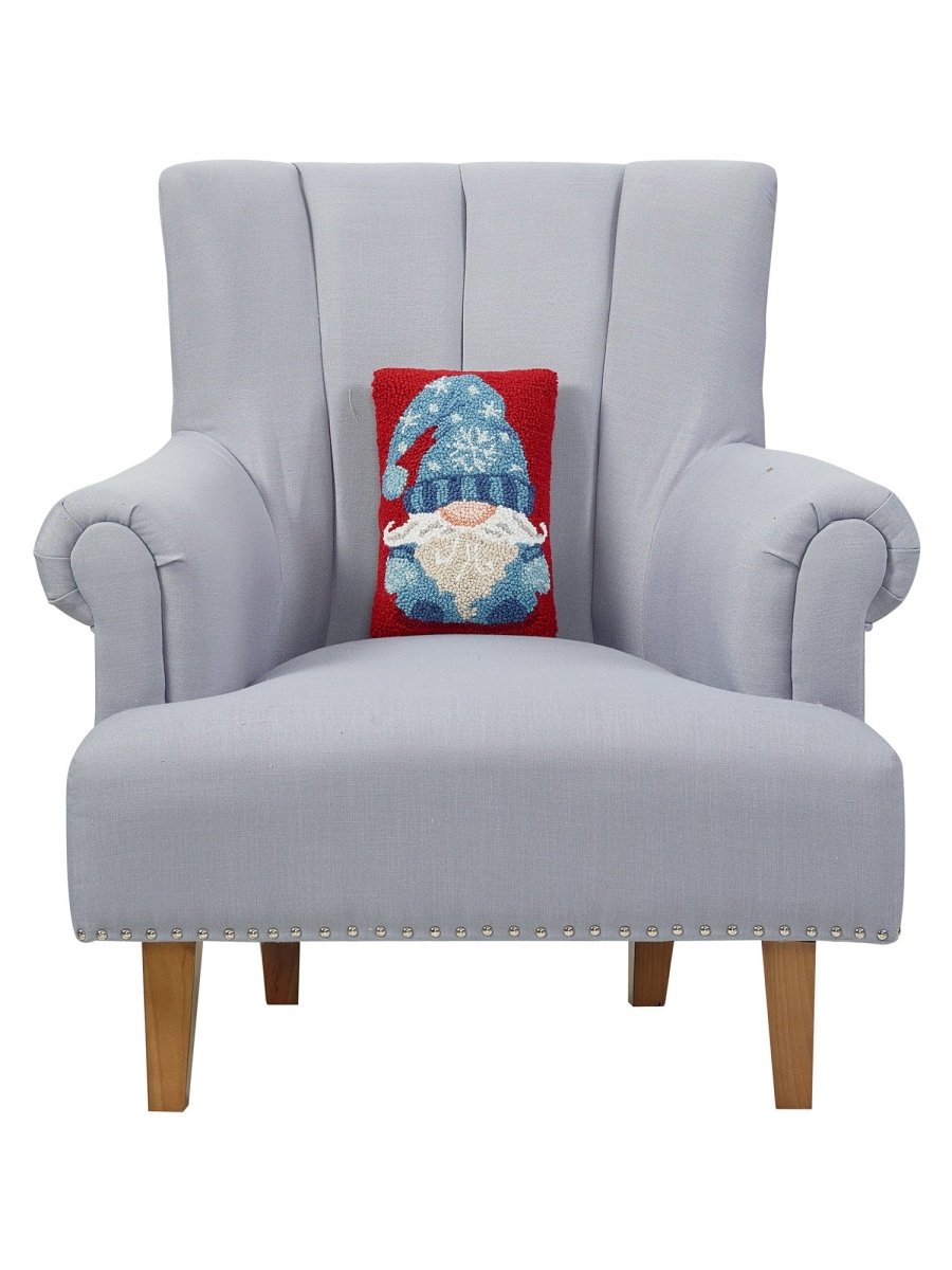 Blue Gnome Hooked Wool Christmas Throw Pillow on an armchair, showing the throw pillow at room scale, 8x12 inch