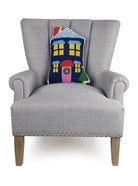 Blue House Shaped Hooked Wool Christmas Throw Pillow on an armchair, showing the throw pillow at room scale, 12x18 inch