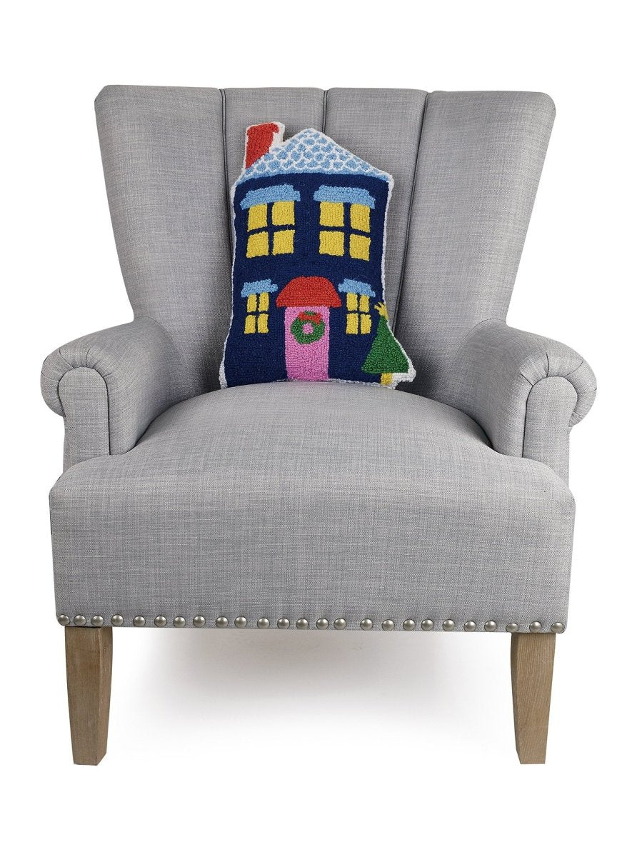 Blue House Shaped Hooked Wool Christmas Throw Pillow on an armchair, showing the throw pillow at room scale, 12x18 inch