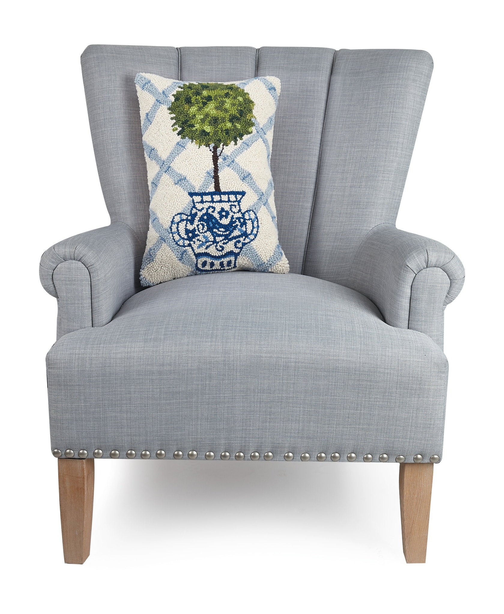 Blue Lattice Ball Topiary Hooked Wool Throw Pillow on an armchair, showing the throw pillow at room scale, 12x18 inch