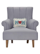 Blue Mom Hooked Throw Pillow on an armchair, showing the throw pillow at room scale, 8x12 inch