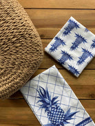 Blue Pineapple All Over Kitchen Towel, 18x25 inch, folded and stacked with the plain pineapple towel
