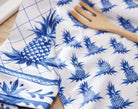 Blue Pineapple Kitchen Towel, 18x25 inch, hanging from an oven handle in a white kitchen
