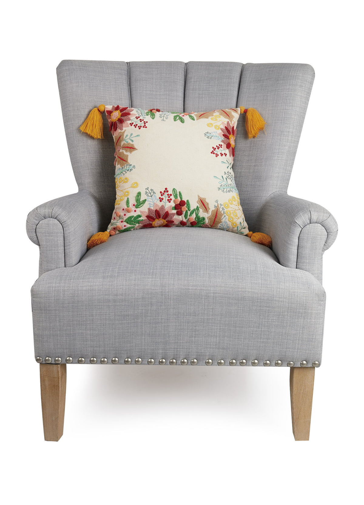 Boho Holiday Floral Embroidered Christmas Throw Pillow on an armchair, showing the throw pillow at room scale, 16x16 inch