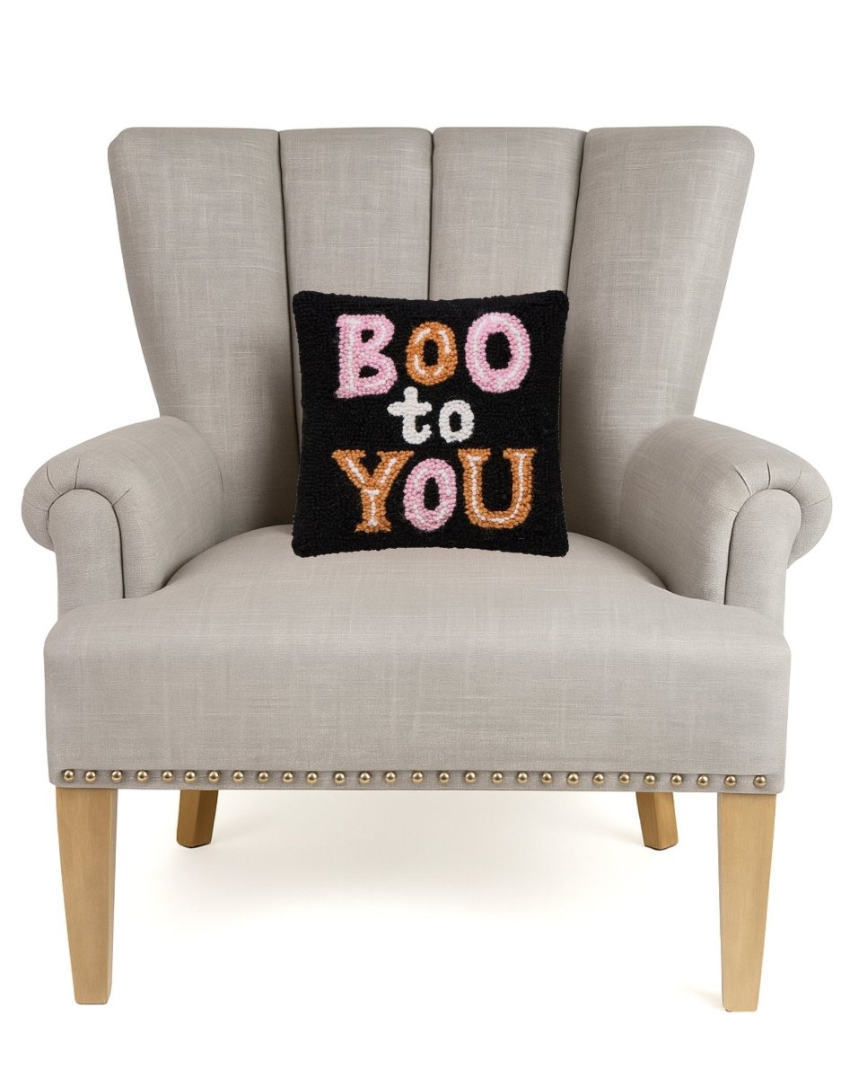Boo to You Hooked Wool Halloween Throw Pillow on an armchair, showing the throw pillow at room scale, 10x10 inch