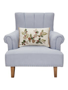Branches Embroidered Christmas Throw Pillow on an armchair, showing the throw pillow at room scale, 12x18 inch