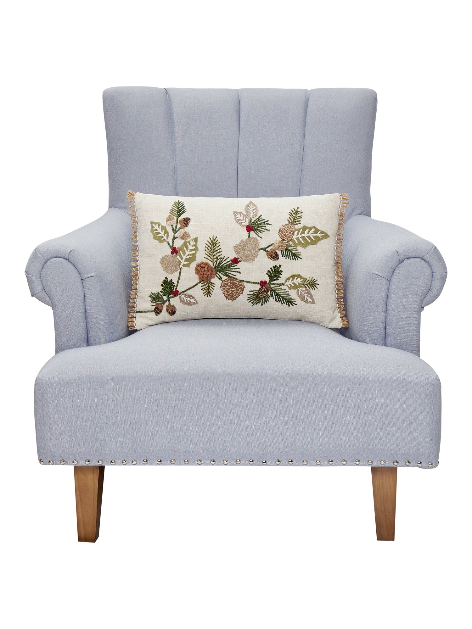 Branches Embroidered Christmas Throw Pillow on an armchair, showing the throw pillow at room scale, 12x18 inch
