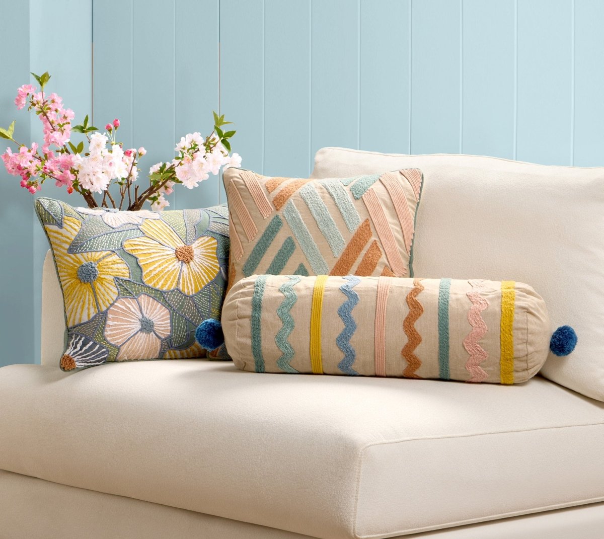 Bright Flowers Embroidered Throw Pillow shown alongside other designs in the same collection, 14x20 inch