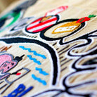 Brooklyn, NY Iconic Bridge Embroidered Throw Pillow - close-up detail of hand-embroidered needlepoint stitching