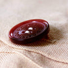Brooklyn, NY Iconic Bridge Embroidered Throw Pillow - detail of decorative button closure
