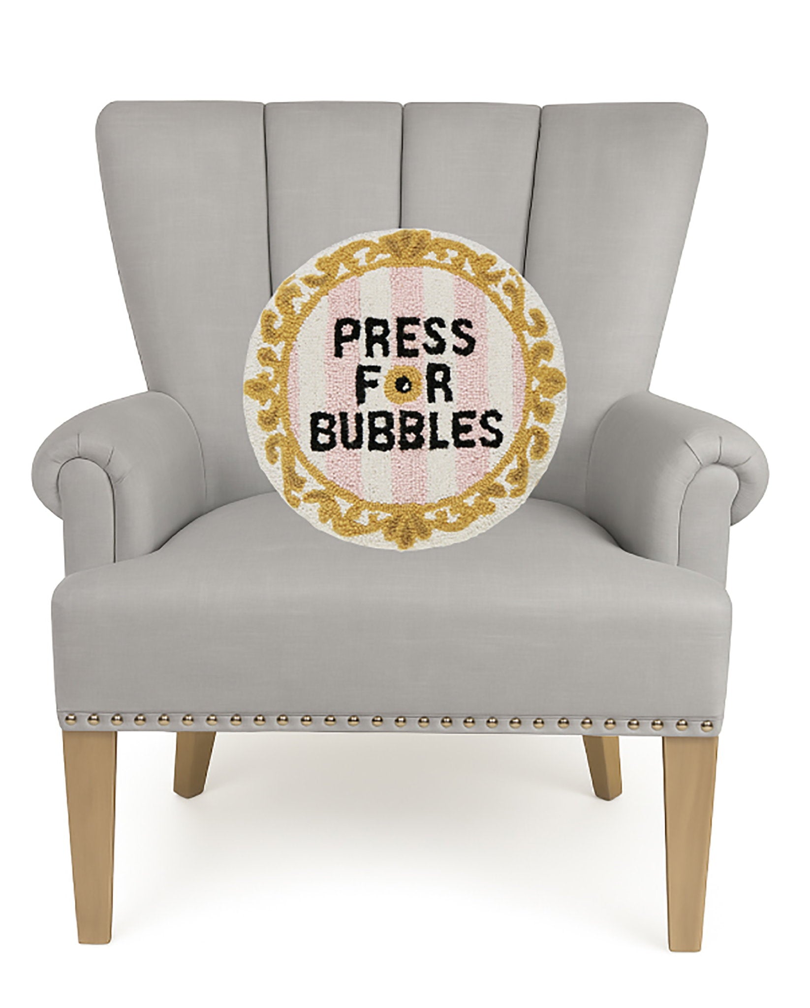 Bubbles Bell Hooked Wool Throw Pillow on an armchair, showing the throw pillow at room scale, 16x16 inch