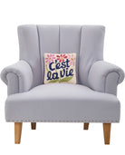 C'est La Vie Hooked Wool Throw Pillow on an armchair, showing the throw pillow at room scale, 10x10 inch