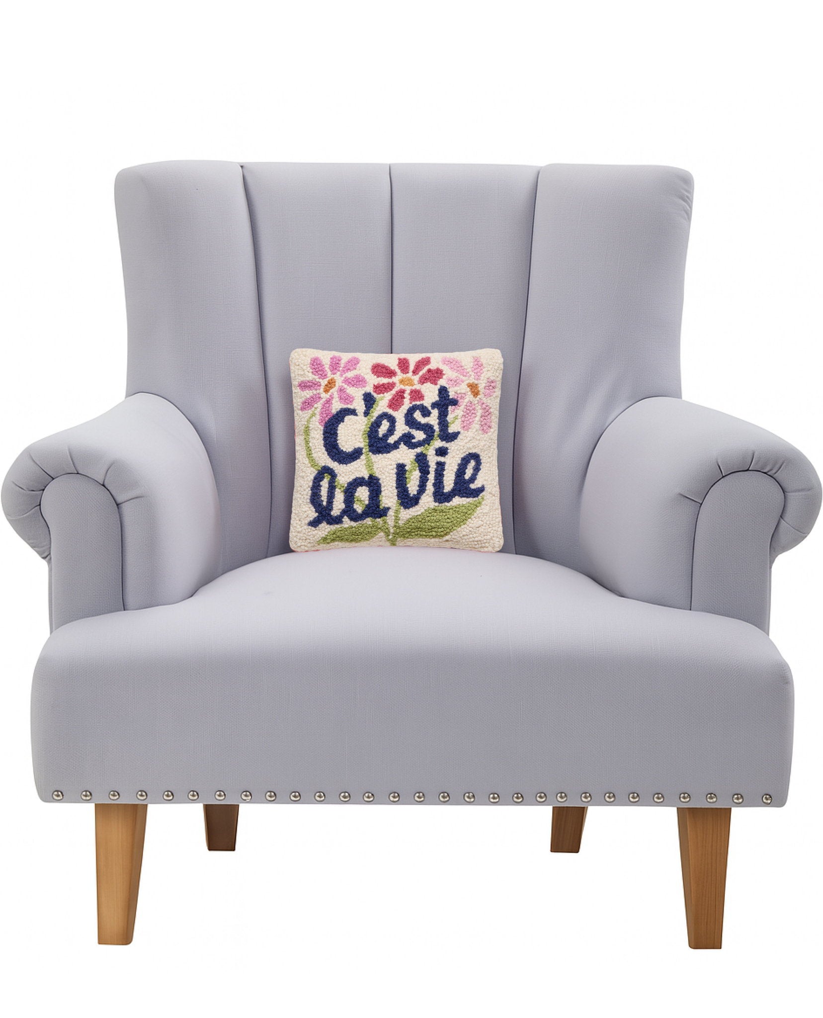 C'est La Vie Hooked Wool Throw Pillow on an armchair, showing the throw pillow at room scale, 10x10 inch