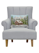 Cabin Hooked Wool Christmas Throw Pillow on an armchair, showing the throw pillow at room scale, 14x18 inch
