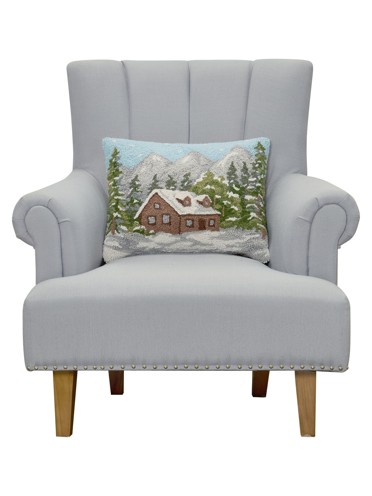 Cabin Hooked Wool Christmas Throw Pillow on an armchair, showing the throw pillow at room scale, 14x18 inch
