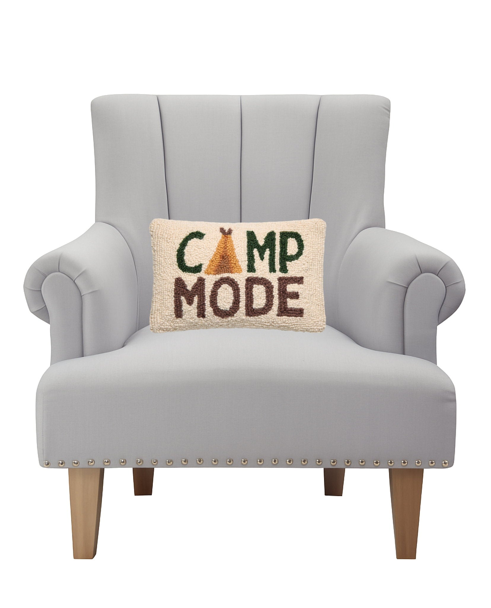 Camp Mode Hooked Wool Throw Pillow on an armchair, showing the throw pillow at room scale, 8x12 inch