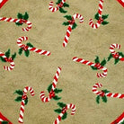 Candy Cane Pine Cone rug texture closeup showing hand-stitched needlepoint wool fiber detail