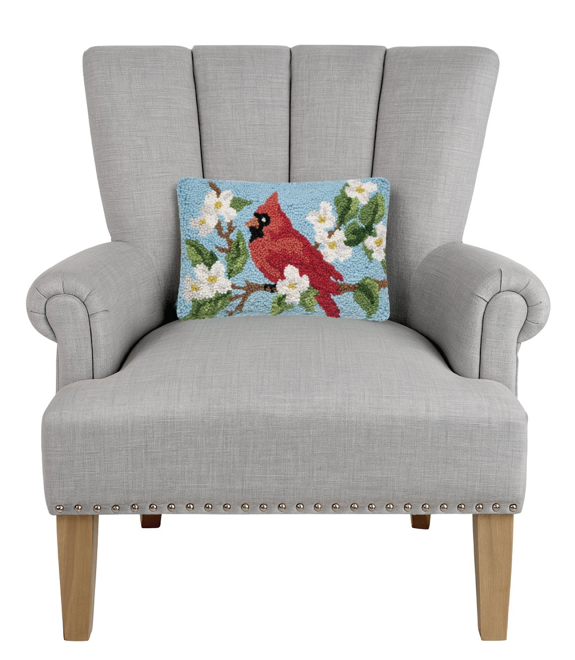 Cardinal Hooked Wool Throw Pillow on an armchair, showing the throw pillow at room scale, 8x12 inch
