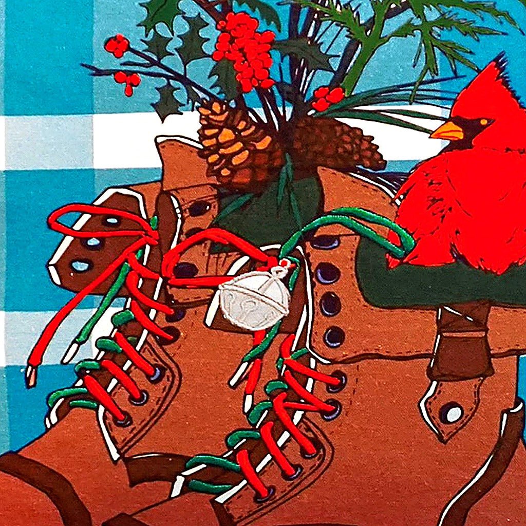 Closeup of Cardinal Winter Boots needlepoint throw pillow highlighting hand-stitched wool craftsmanship and fabric detail