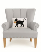 Cat with Pumpkin Hooked Wool Fall Harvest Throw Pillow on an armchair, showing the throw pillow at room scale, 8x12 inch