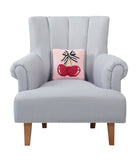 Cherries with Ribbon Hooked Wool Throw Pillow on an armchair, showing the throw pillow at room scale, 10x10 inch