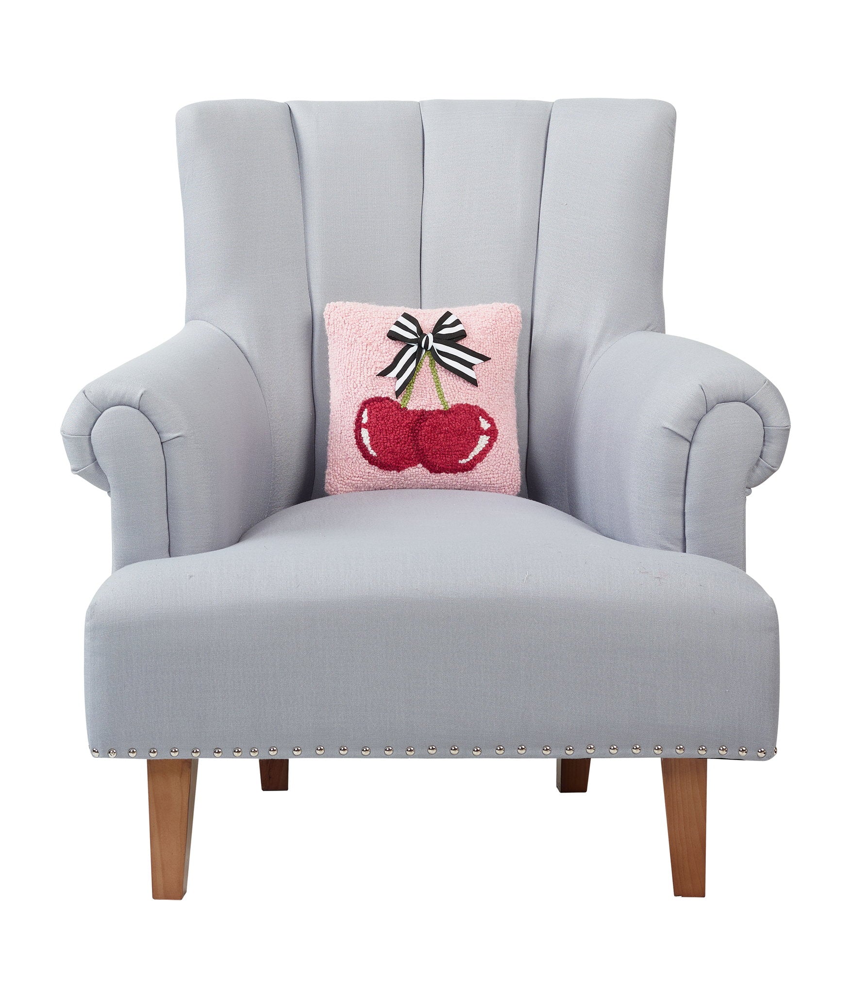 Cherries with Ribbon Hooked Wool Throw Pillow on an armchair, showing the throw pillow at room scale, 10x10 inch
