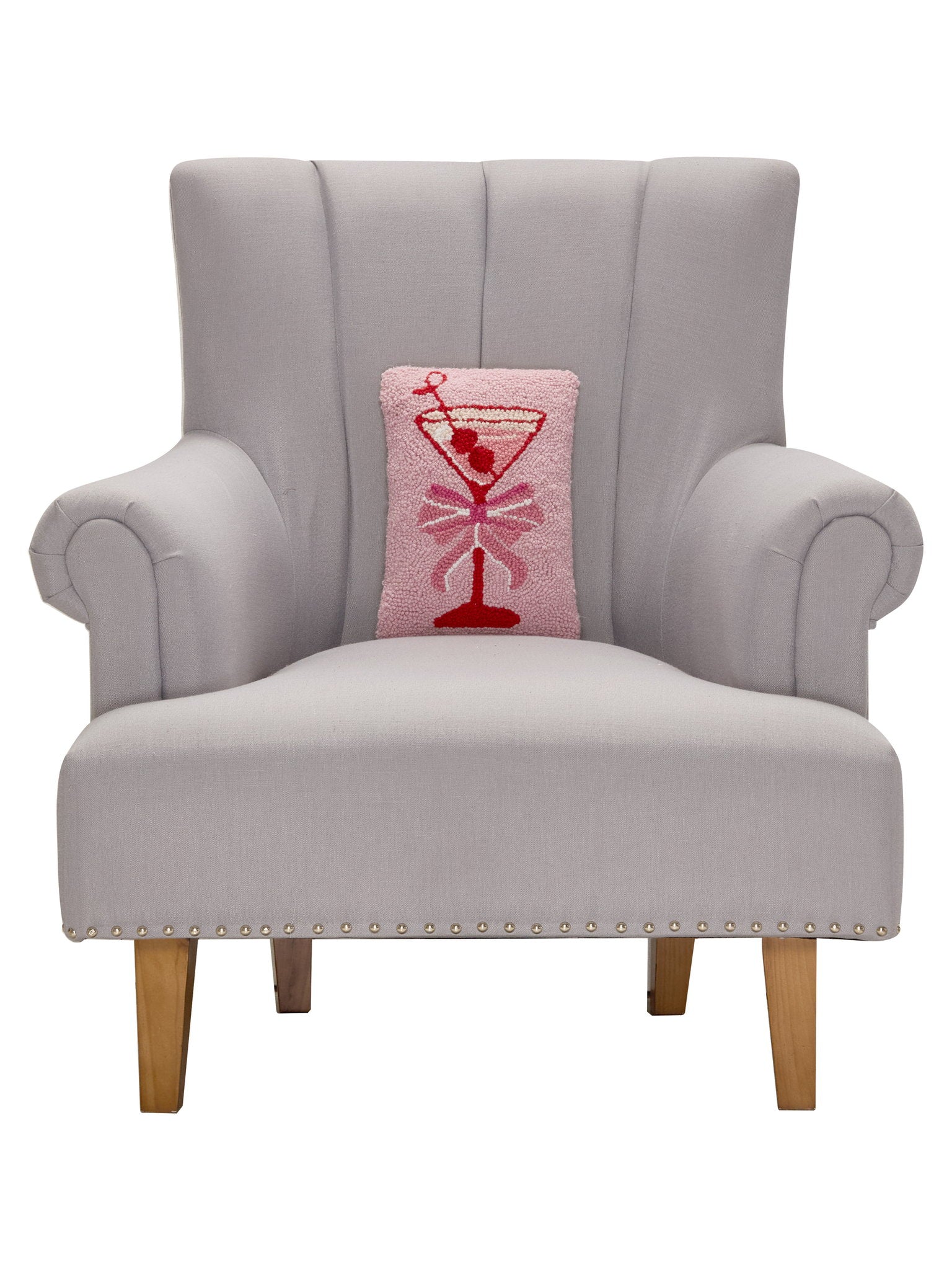 Cherry Martini Hooked Wool Throw Pillow on an armchair, showing the throw pillow at room scale, 8x12 inch