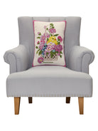 Chick Hooked Wool Easter Throw Pillow, 14x20 inch, on a gray armchair, closer view of the chair