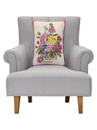 Chick Hooked Wool Easter Throw Pillow, 14x20 inch, standing upright on a gray armchair seat