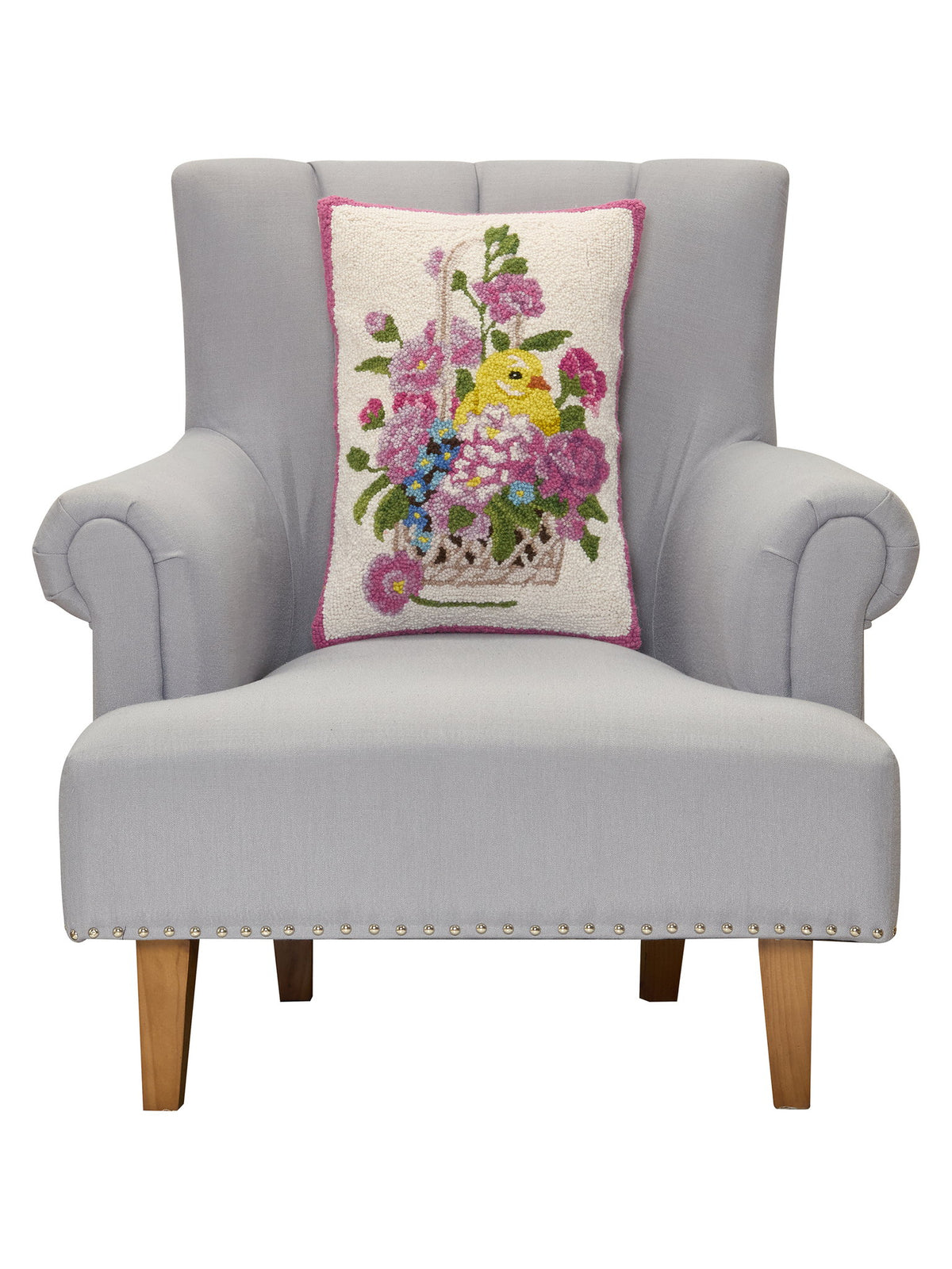 Chick Hooked Wool Easter Throw Pillow, 14x20 inch, standing upright on a gray armchair seat