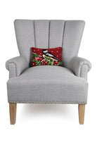 Chickadee on Branch Hooked Wool Christmas Throw Pillow on an armchair, showing the throw pillow at room scale, 8x12 inch