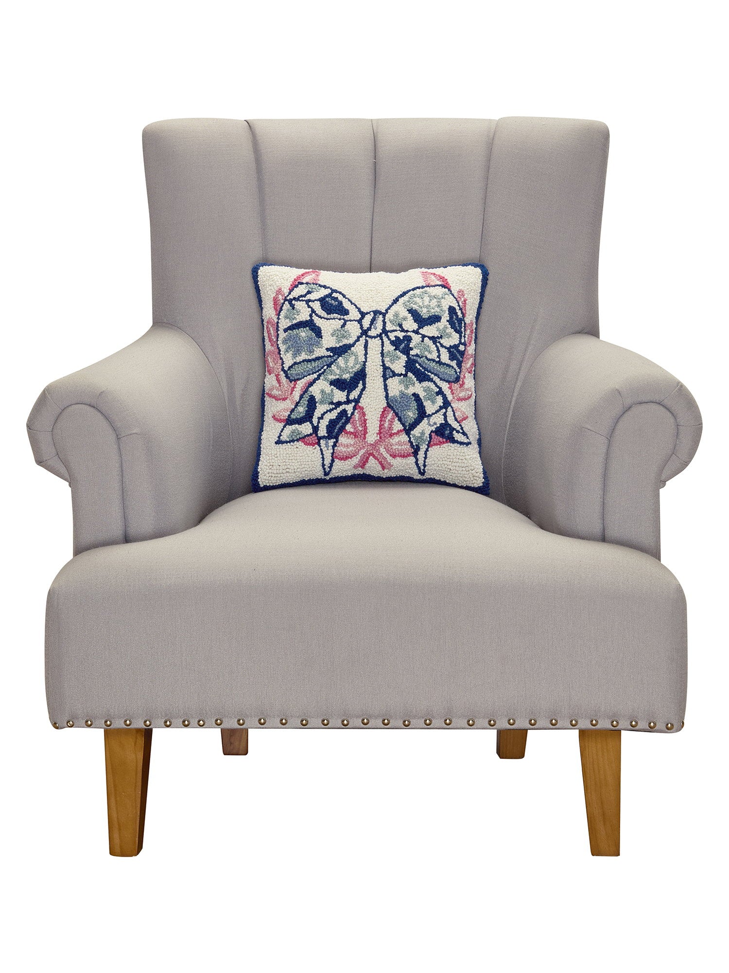 Chinoiserie Bow Hooked Wool Throw Pillow on an armchair, showing the throw pillow at room scale, 14x14 inch