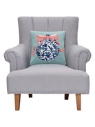 Chinoiserie Easter Egg Hooked Wool Throw Pillow on an armchair, showing the throw pillow at room scale, 16x16 inch