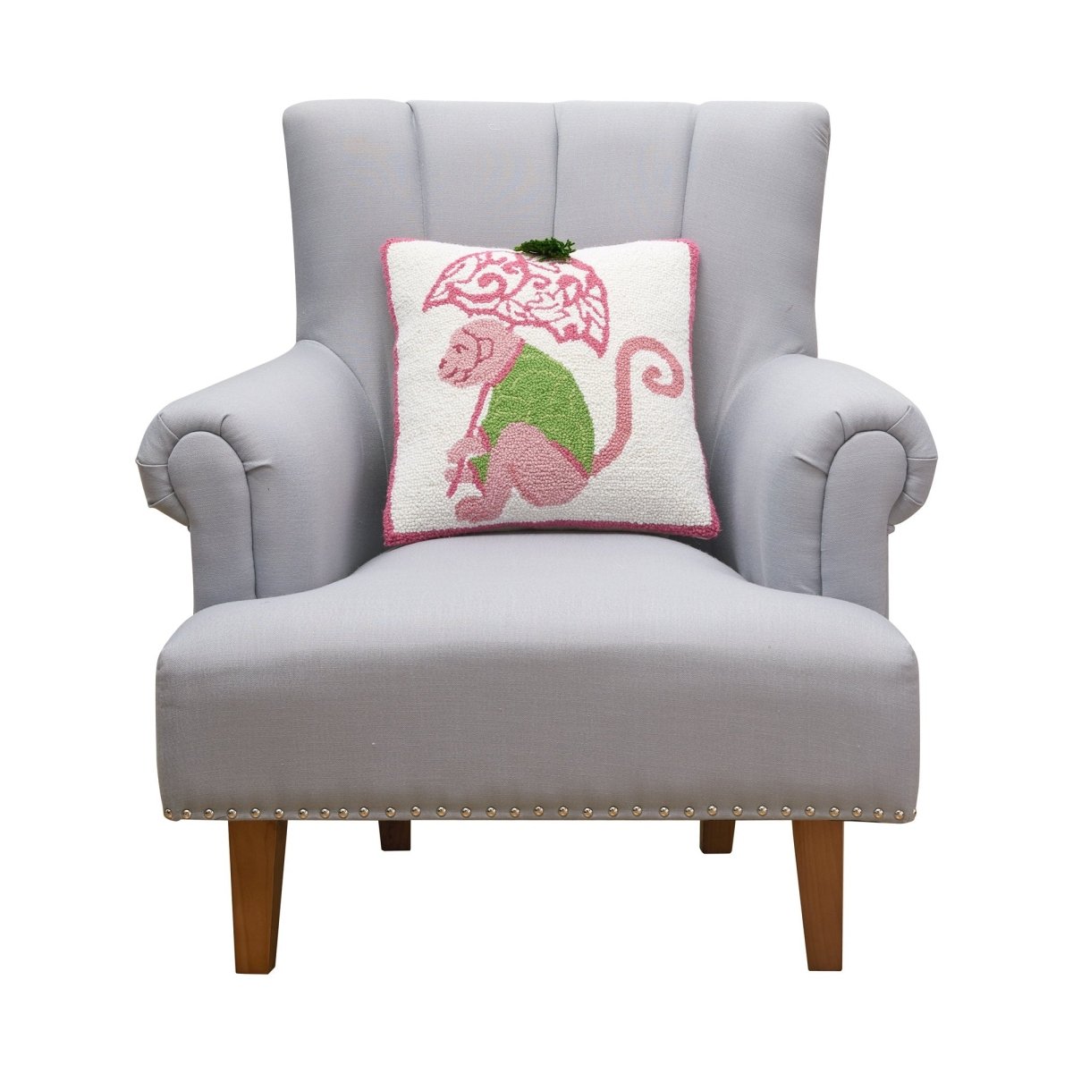 Chinoiserie Monkey Hooked Wool Throw Pillow on an armchair, showing the throw pillow at room scale, 16x16 inch