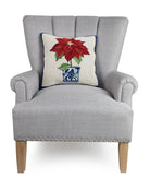 Chinoiserie Poinsettia Hooked Wool Christmas Throw Pillow on an armchair, showing the throw pillow at room scale, 16x16 inch