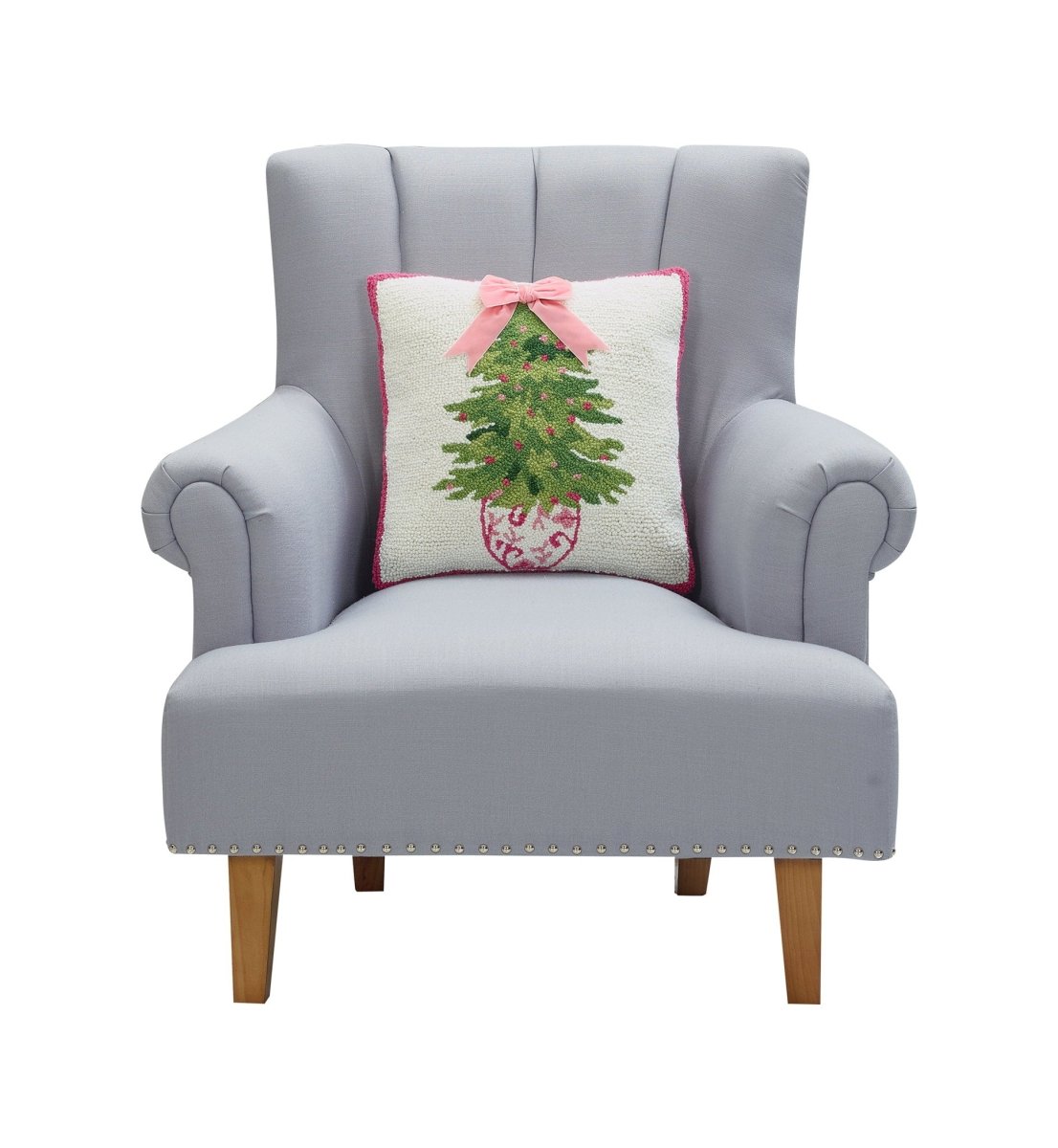 Chinoiserie Ribbon Tree Hooked Wool Christmas Throw Pillow on an armchair, showing the throw pillow at room scale, 16x16 inch