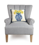 Chinoiserie Vase Daffodils Hooked Wool Throw Pillow on an armchair, showing the throw pillow at room scale, 16x16 inch