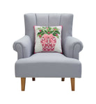 Chinoiserie Vase Ribbon Hooked Wool Christmas Throw Pillow on an armchair, showing the throw pillow at room scale, 16x16 inch