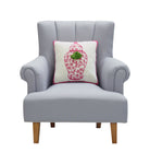 Chinoiserie Vase with Tassels Hooked Wool Throw Pillow on an armchair, showing the throw pillow at room scale, 16x16 inch