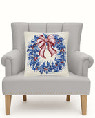 Chinoiserie Wreath Hooked Wool Christmas Throw Pillow on an armchair, showing the throw pillow at room scale, 18x18 inch