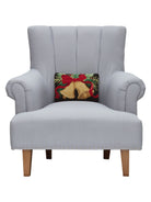 Christmas Bell Hooked Wool Throw Pillow on an armchair, showing the throw pillow at room scale, 8x12 inch