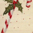 Closeup of Christmas Candy Cane Holiday needlepoint throw pillow highlighting hand-stitched wool craftsmanship and fabric detail