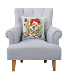 Christmas Corgi Hooked Wool Throw Pillow on an armchair, showing the throw pillow at room scale, 16x16 inch